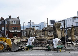 Charred remains of Reeves furniture shop Croydon, South London, following riots on Monday