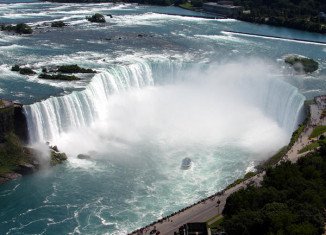 Police warned tourists Monday not to climb a railing at the top of Niagara Falls after an international student from Japan fell off the edge and was swept over the falls on the weekend