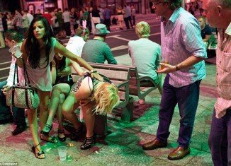 Cardiff After Dark portfolio presents the images of the British night life with young women and men vomiting and sleeping on the streets after weekend parties