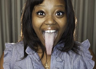 Chanel Taper in the 2012 edition of Guinness Book of World Records for the longest tongue , measuring 4 inches (about 10.16 cm)