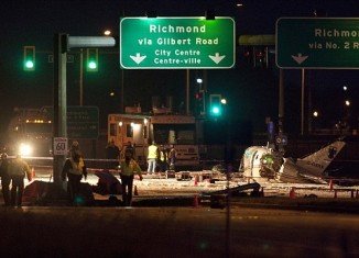 A small passenger aircraft crashed on Russ Baker Way, a busy street from Richmond, Canada, injuring all nine aboard, but miraculously all passengers were alive
