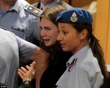 Amanda Knox bursts into tears after she was sensationally cleared of the murder of Meredith Kercher