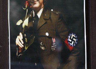 Angela Merkel wears a swastika armband bearing the EU stars logo on the outside
