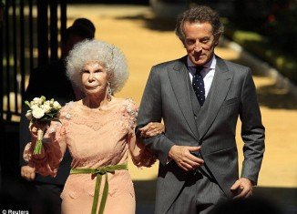 Duchess of Alba, 85, with her new husband Alfonso Diez, 60, at their wedding in Seville