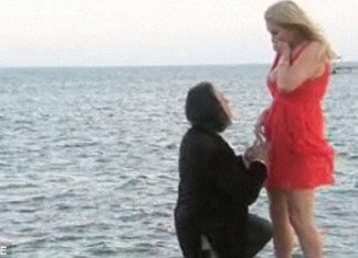 "It's funny, they used to watch movies where they say I can't live without you but for me it's true," said Gene Simmons and got down on one knee.