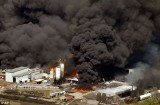 Giant plumes of noxious smoke, which could be seen for miles, rise from the Magnablend Chemical Plant, not far from houses and apartments on Highway 287 Bypass in Texas