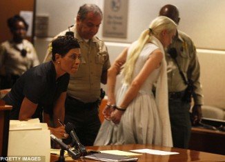 Lindsay Lohan left the court in handcuffs and was taken into custody today after a judge blasted her for violating probation