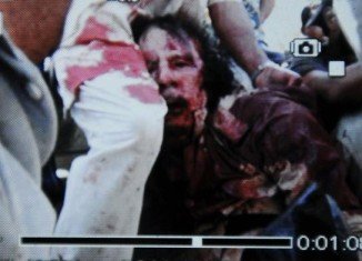 Muammar Gaddafi Wounded or Dead Corpse