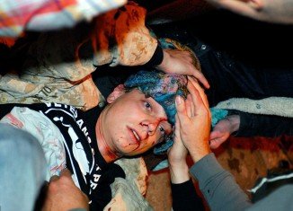 Scott Olsen, an Iraq war veteran was critically injured by a projectile during Tuesday night clash between Occupy Oakland protesters and police