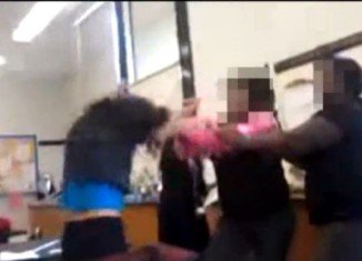 The shocking video shows two students-girls from Roger C. Sullivan High School, a Chicago public school, who were severely beating a 14-year-old classmate