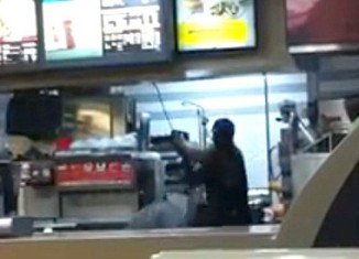 The video clip shows Rayon McIntosh, a Greenwich Village McDonald’s cashier, viciously beating two women with a metal rod