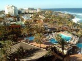 A British tourist was left dangling naked, upside down, in the stairwell of a hotel from Tenerife, Spain, after she tumbled over a handrail while having sex with her husband