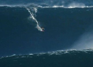 Garrett McNamara, an extreme Irish surfer is set to earn a place in the record books after riding a 90 foot wave in Portugal