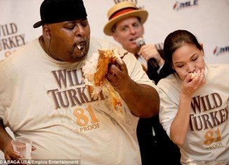 Sonya Thomas, 42, who is 5ft 5in and weighs 105lb claimed her record as part of the Wild Turkey 81 Eating World Championship, held in Times Square, New York