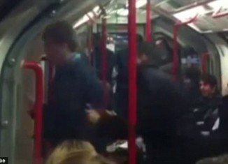The video clip shows the dancing man happily ignoring fellow passengers as he boogies to the music playing through his headphones was shot by a fellow passenger seated further along the carriage