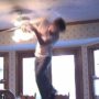Funny video: stuntman grabbing a tomato attached near a ceiling fan