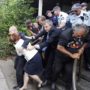 Australia: PM Julia Gillard rescued after becoming trapped in a restaurant by angry protesters