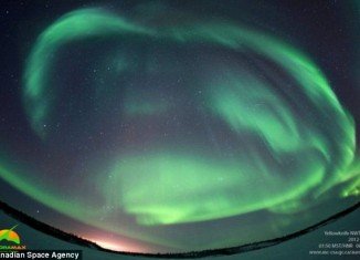 An amazing picture of the aurora borealis - the Northern Lights - shows how the phenomenon can light up the sky near the North Pole