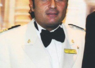 Francesco Schettino had been drinking “with a beautiful woman” at the ship's bar before he sailed into disaster