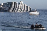 The death toll of Costa Concordia cruise ship disaster is raised to 13 after divers have found the body of a woman in the wreck of vessel