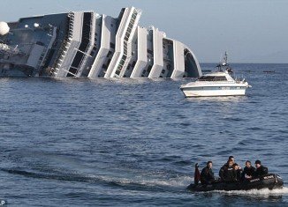 The death toll of Costa Concordia cruise ship disaster is raised to 13 after divers have found the body of a woman in the wreck of vessel