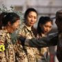 Chinese female bodyguards training: bottle smashed over the recruit head