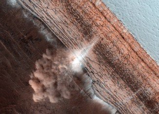 Images of an avalanche of fine ice and dust thundering over a cliff near Mars's north pole have been captured by a high resolution camera from a NASA spacecraft