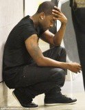Ray J, Whitney Houston’s on-off lover, was seen overcome with emotion as he arrived back at Los Angeles' LAX airport yesterday following the singer's funeral