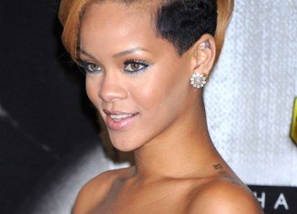 Rihanna is shortlisted to star as Whitney Houston in a movie biopic of the late singer