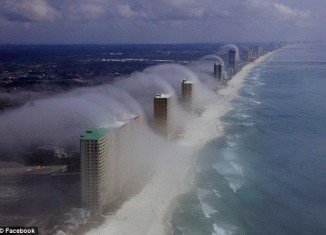 The natural phenomenon “waves of clouds” occurred as a result of warm, moist air forming "just right" as it blew into the coastline, forming a low-lying fog that dissipates as the air cools with altitude
