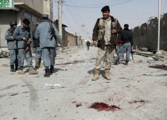 Two civilians and at least five police officers have died in a car bomb attack on police headquarters in the city of Kandahar, southern Afghanistan