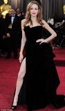 Angelina Jolie claims she has paid no notice to the furor that followed her leg-baring incident at this year's Oscars last month