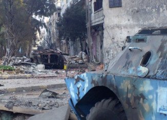 At least 47 people have been killed in an attack by pro-government militia in the embattled Syrian city of Homs