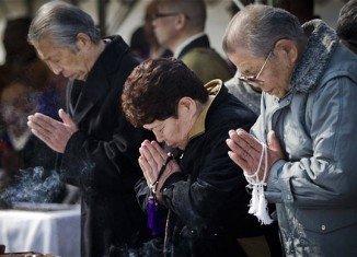Japan marks one year commemoration of the devastating earthquake and tsunami, which struck the north-eastern coast, leaving 20,000 dead or missing