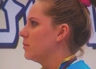 Kazakh gold medalist Maria Dmitrienko listened to the Borat anthem without emotion and finally smiling as it ends