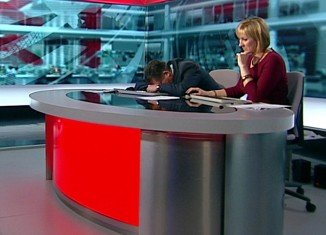 Simon McCoy, the BBC Breakfast show presenter, has been caught apparently asleep on his desk during this morning show