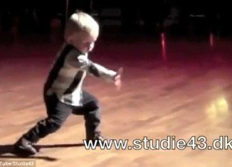 William Stokkebroe, 2, wins over the crowd by gyrating his hips, clapping, tapping his feet and attempting to sing along to Jailhouse Rock