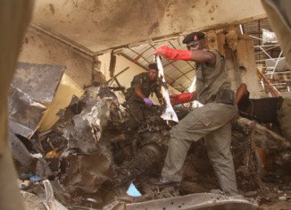 At least six people have been killed in two explosions at the offices of major Nigerian daily ThisDay
