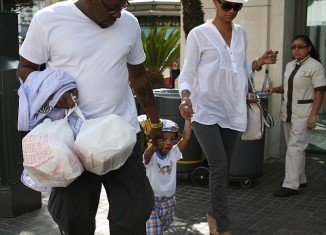 Bobby Brown showed off his gentler side as he walked hand in hand with his son Cassius and fiancée Alicia Etheridge at The Grove shopping centre in Los Angeles