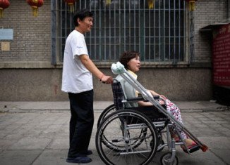 Disabled Chinese land rights lawyer Ni Yulan and her husband Dong Jiqin have been jailed a year after they were detained