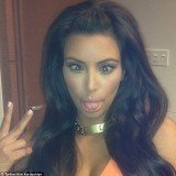 During The Kardashian Kollection launch at the Woodfield Mall in Schaumburg, Kim Kardashian posted several pictures of herself, including one of her pulling faces for the camera