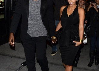 Kim Kardashian and Kanye West arrived together holding hands to the opening of Kourtney's boyfriend Scott Disick's restaurant