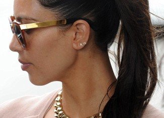 Kim Kardashian wearing Kanye West's initials in her ear