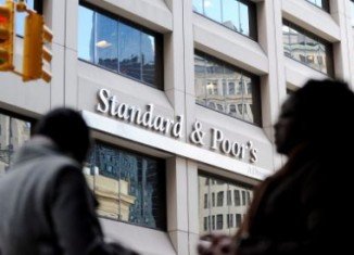 Standard & Poor's has cut Spain's credit rating and warned of risks to come