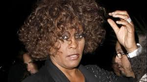 Whitney Houston was buried with a diamond brooch and earrings next to the body of her father John Russell Houston Jr