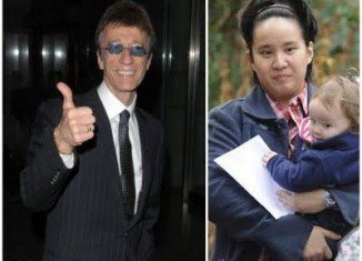 After 12 months of legal wrangling Robin Gibb's lover Claire Yang is said to have received the one off payment for three-year-old Snow Robin's care
