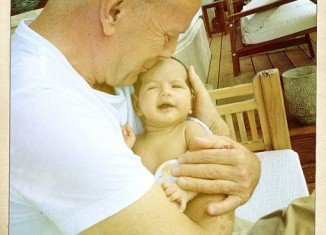 Emma Heming has posted an adorable photo on Twitter of Bruce Willis cuddling little Mabel Ray in his arms