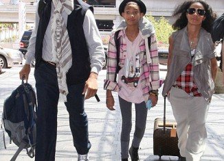 Mere days after laughing off reports that Will Smith and wife Jada Pinkett are splitting up, they made a show of family support by turning up at LAX together yesterday with daughter Willow in tow