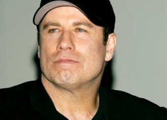 One of the two male masseurs who have claimed actor John Travolta had sexually assaulted them has withdrawn his legal action