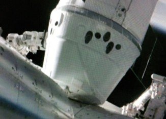 SpaceX unmanned Dragon cargo ship has been successfully attached to the International Space Station (ISS)